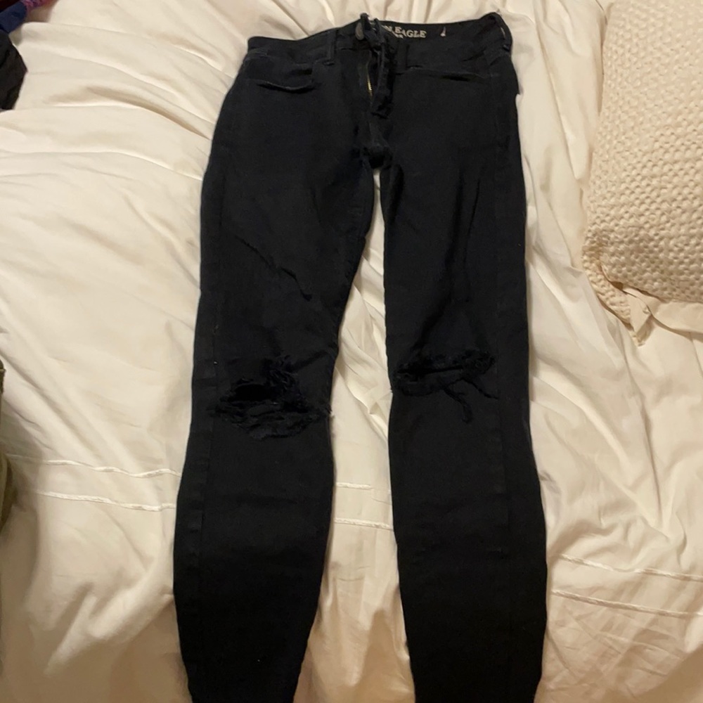 Black skinny jeans with holes on the knees